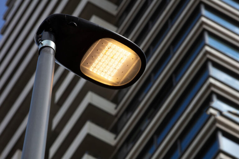 Led Streetlight With A Modern Building In The Background